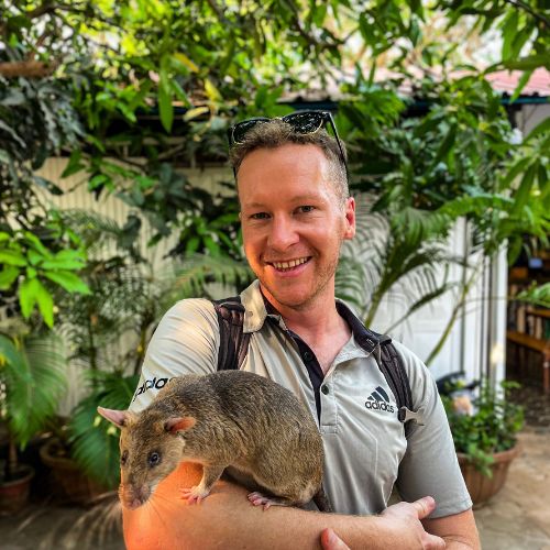 Visiting the Apopo centre and holding a giant pouched rat.